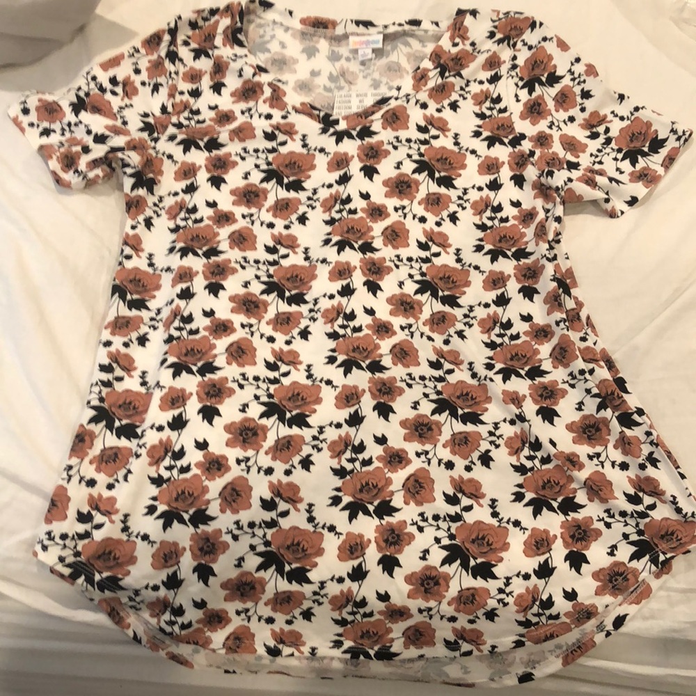 NWT never worn Iris size Large. Beautiful rose print and color!